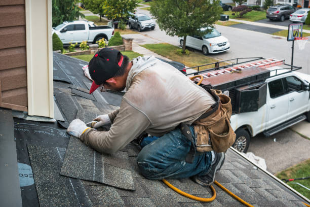 Professional Storm Damage Roof Repair technician working in Warren, IN